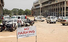 Vehicles parked illegally in open spaces to evade fee at the newly introduced paid parking facility in Sector 34 on Saturday.