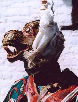 A masked man at the Bumthang festival