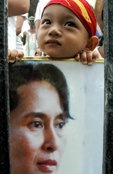 A supporter of Burmese democracy holds a portrait of Aun San Suu Kyi duirng a march on the eve of the 60th birthday of imprisoned Burmese leader in New Delhi on Saturday. 