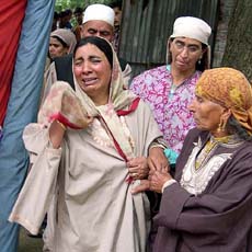 Relatives wail over the death of PDP leader Ghulam Rasool Bhat, who was killed by militants at Iaar Ganderbal, east of Srinagar, on Sunday.