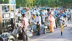 Heavy rush at a company owned petrol station in Chandigarh on Monday. 
