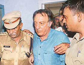Former Indian cricket captain Mansur Ali Khan Pataudi comes out of a Jhajjar court after being granted bail