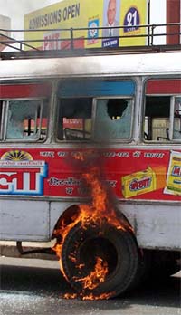 A bus is torched in Lucknow on Monday during a protest organised by the BJP Yuva Morcha against the removal of Deen Dayal Upadhyays statue in Rampur