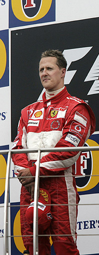 Ferrari Formula One driver Michael Schumacher of Germany stands on the podium at the Indianapolis Motor Speedway after winning the US Grand Prix on Sunday