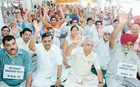 Members of the Chandigarh Housing Board Residents Federation protest in support of their demands in Sector 17