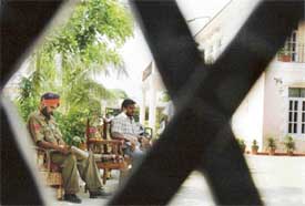 A cop on duty outside the house of retd. patwari Bawa Singh Pandher where a major dacoity took place on Monday