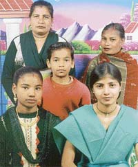 A file photo of little Vicky with his sisters and mother
