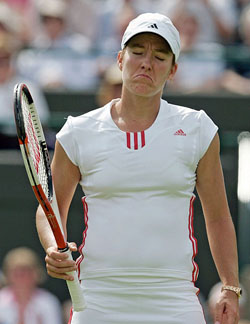 Belgium's Justine Henin-Hardenne shows her frustration during her first round women's singles match against Eleni Daniilidou of Greece