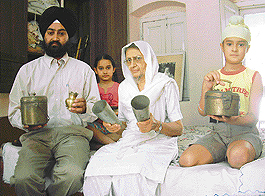 Mr Mandip Singh, grandson of Master Tara Singh, shows traditional utensils that were used by the Sikh leader.