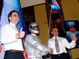 Managing Director of Oracle India Krishan Dhawan (L) poses with an astronaut during a press conference in New Delhi on Wednesday.