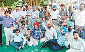 Members of the Punjab and Chandigarh College Teachers Union protest in Sector 17, Chandigarh
