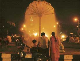 With the mercury going up, a family tries to seek solace near a fountain in Ludhiana on Wednesday