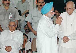 Prime Minister Manmohan Singh with BJP President L.K. Advani at the BJP headquarters after paying homage to former Governor and BJP leader Sunder Singh Bhandari in New Delhi on Wednesday.  Former Prime Minister Atal Bihari Vajpayee is also seen.