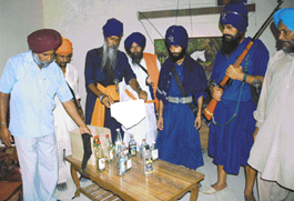 Whisky bottles and other stuff allegedly found in the room of Nihang Ajit Singh Poolha in Sector 39, Chandigarh, on Thursday.
