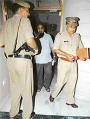 Policeman investigate the murder of an elderly couple in Ambala on Thursday night. 