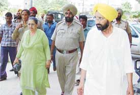 The accused Bawa Singh and his wife Amarjit Kaur being taken to the court of a Duty Magistrate in Ludhiana on Thursday