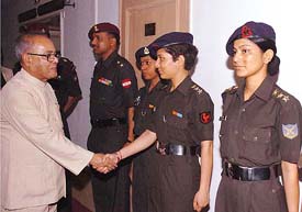 Defence Minister Pranab Mukherjee greets members of the Army Womens Everest Expedition during the flag-in ceremony in New Delhi on Thursday. 