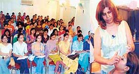 Beauty expert Indra Ahluwalia provides tips on beauty and make-up to participants during a workshop