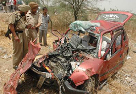 The mangled remains of the car that met with an accident, killing six persons on the Jalandhar-Amritsar road, near Kartarpur, on Friday. 