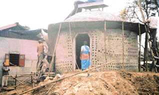 the earthship shelter on the Andamans is made of bottles, tyres, plastic and bamboo