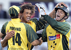 Australias Ricky Ponting (left) and Adam Gilchrist (right) congratulate Andrew Symonds for taking the wicket of Englands Kevin Pietersen during their one-day match at Chester-le-Street, northern England.