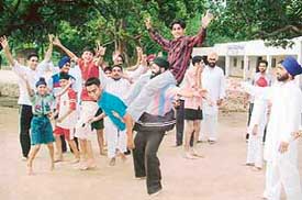Children learning bhangra at free camp