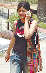 A girl student is all smiles as she emerges from a DU college after a look at the list