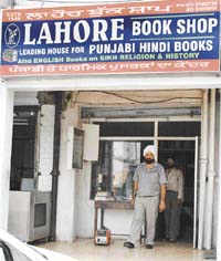 Mr Tejinder Singh Bir outside his shop that has its roots in Pakistan