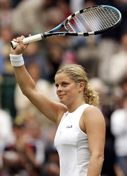 Belgium's Kim Clijsters celebrates winning her third round match against Italy's Roberta Vinci at the Wimbledon tennis championships in London
