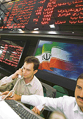 Iranian dealers take orders at the Teheran stock market on Sunday.