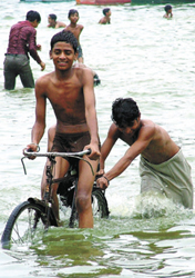 Children indulge in fun and frolic at the Boat Club as the skies finally opened up over the Capital on Sunday.