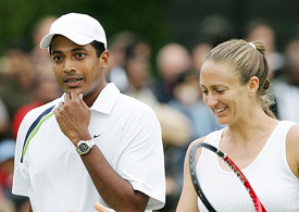 Indias Mahesh Bhupathi and Frances Mary Pierce talk during their first round mixed doubles match against David Sherwood and Amanda Janes of Great Britain at Wimbledon
