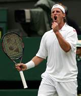 Argentinas David Nalbandian celebrates after winning his third round match against Great Britains Andrew Murray at Wimbledon on Saturday