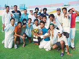 Chandigarh players pose with the trophy after winning F.C. Mittal  tournament at PCA Stadium, Mohali