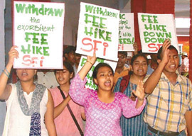 Activists of the Student Federation of India demonstrating at Kirori Mal College against a fee hike by Delhi University on Monday