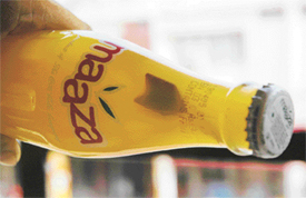 A bottle of Maaza containing a dart-like object