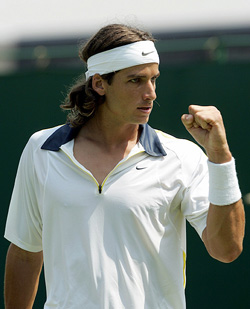 Spains Feliciano Lopez gestures during his mens singles fourth round match against Croatias Mario Ancic at Wimbledon on Monday