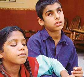 A visually impaired child reflects on his future on the occasion of the 125th birth anniversary of Helen Keller, the first deaf, dumb and blind woman in the world