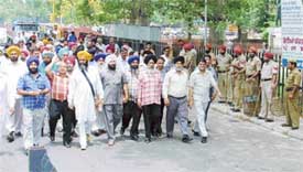 Truck operators on their way to the Mini Secretariat to submit a memorandum to the Deputy Commissioner, Ludhiana, on Tuesday