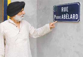 Dr Gill points towards the nameplate of his house that bears the name of French philosopher Pierre Abelard