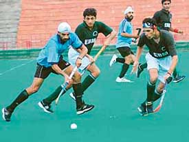 Members of hockey teams of Multan Club, Pakistan, and Chandigarh XI vie for victory in an exhibition match held at Hockey Stadium, Sector 42, Chandigarh on Wednesday