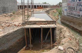 A seasonal choe that has been channelised by a land developer on the inter-state border of Punjab with Haryana at Bartana village, near Zirakpur