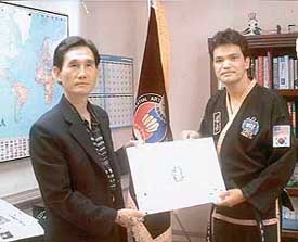 Grand Master Kwang Jo Choi awards the fourth degree Black Belt to Bikram S. Thapa in the USA