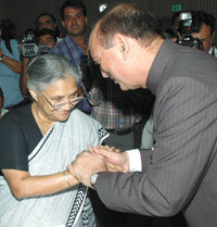 The Urban Development Minister Gulam Nabi Azad greets Delhi Chief Minister Sheila Dikshit at the Chief Ministers Conference on National Urban Transport Policy at Vigyan Bhvan in the Capital on Wednesday