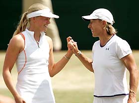 Martina Navratilova of the US and Germany's Anna-Lena Groenefeld celebrate winning their women's doubles quarter-final match against Russia's Vera Douchevina and Israel's Shahar Peer at the Wimbledon tennis championships in London, June 29, 2005. The pair won 7-6 6-4