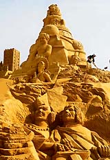 A sand carver at work during the Sand Sculptures Festival in Blankenberge in northern Belgium on Wednesday