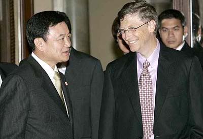 Microsoft Chairman Bill Gates talks with Thailand Prime Minister Thaksin Shinawatra in Bangkok on Thursday. Gates  is in Thailand to promote Microsoft products