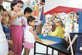 Students of Kidzee Rainbow School go around an exhibition on the concluding day of a summer camp in Ludhiana
