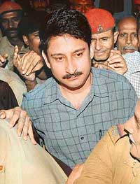 Gautam Goswami, former Patna DM and the main accused in the flood relief scam, surrenders in the Patna Civil Court on Thursday. 