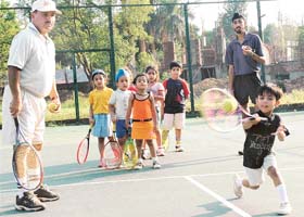 A trainee learns tips at a summer camp at the Tennis Stadium, Sector 10, Chandigarh